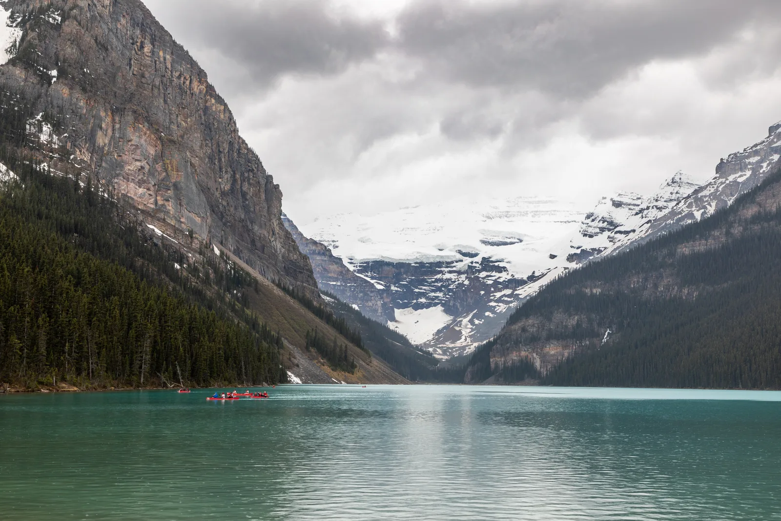 The turquoise water of Lake Louise below the Rockies in Banff, Canada.