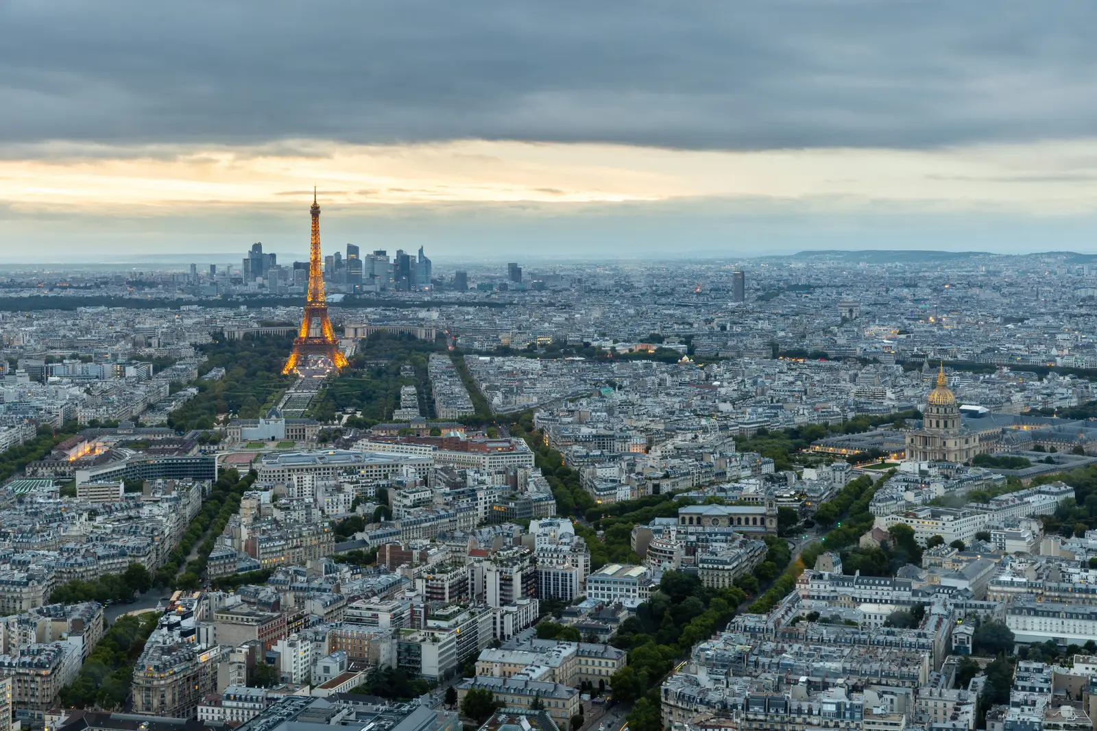 The Eiffel Tower and the rooftops of Paris at sunset, France.
